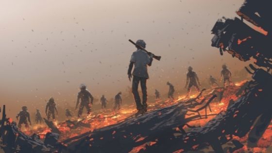 Man with a gun over his shoulder walking through firey coals toward scattered zombies