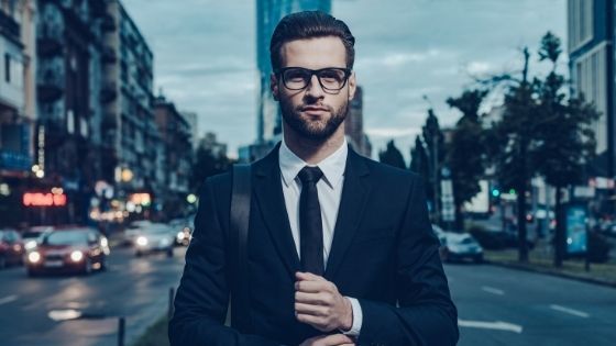 Business man standing in a city